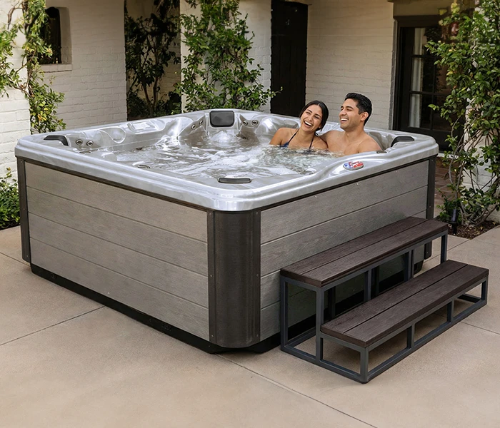 Hot Tubs, Spas, Portable Spas, for sale American Spas American Spas hot tub being used in a family setting